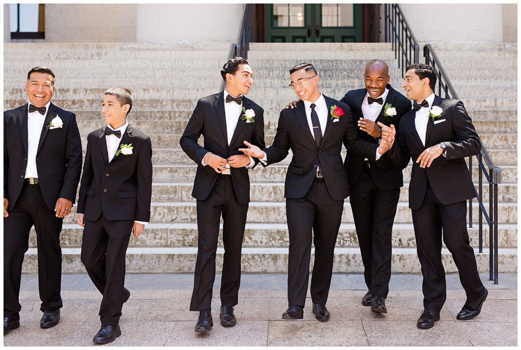 groom laughing with groomsmen at ohio statehouse