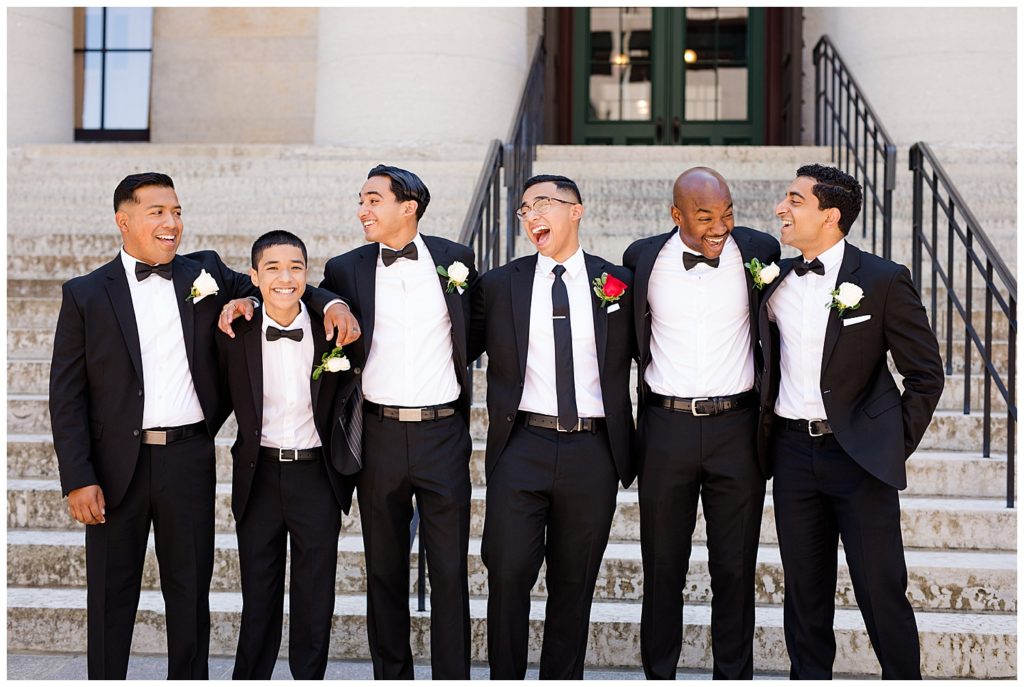 groom laughing with groomsmen at ohio statehouse