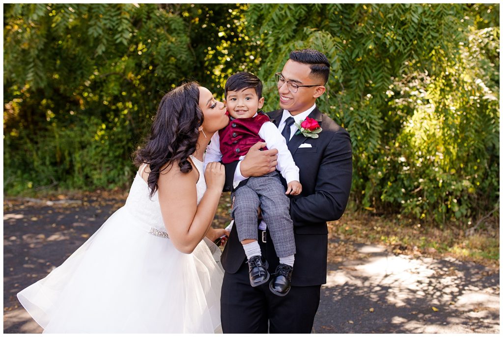 bride and groom with groom's nephew