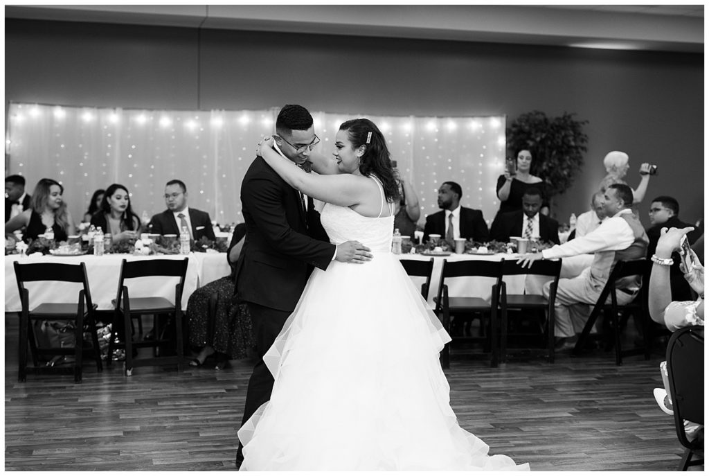 black and white image of bride and groom sharing first dance at stewart hall in obetz