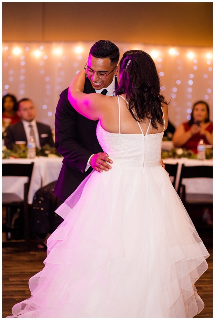 groom laughing as he dances with bride at stewart hall in obetz
