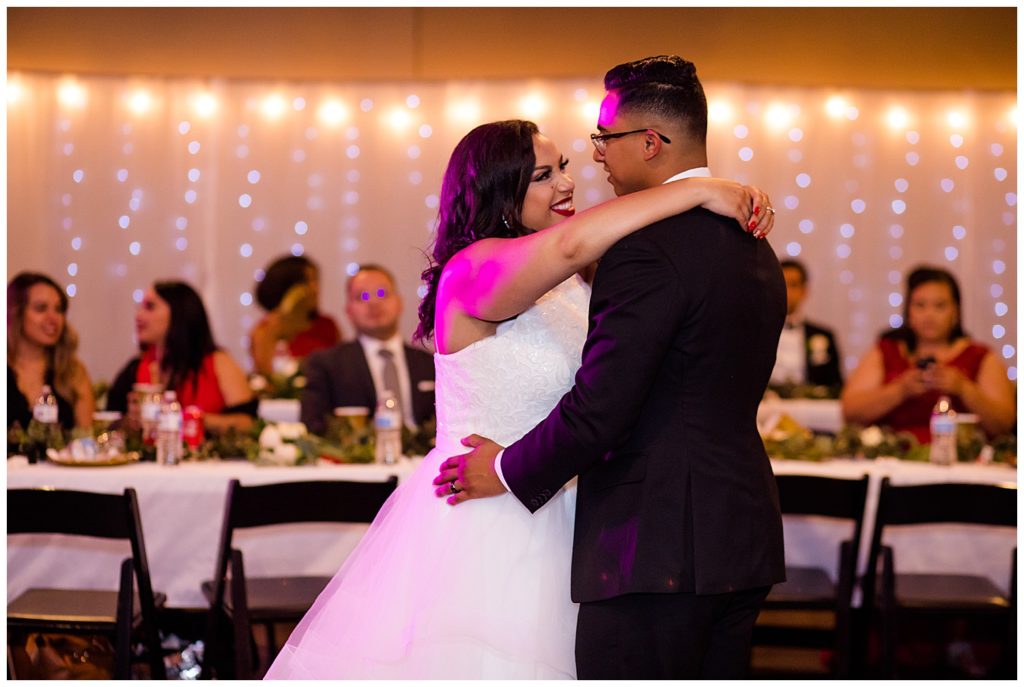 bride smiling as she dances with groom at stewart hall in obetz