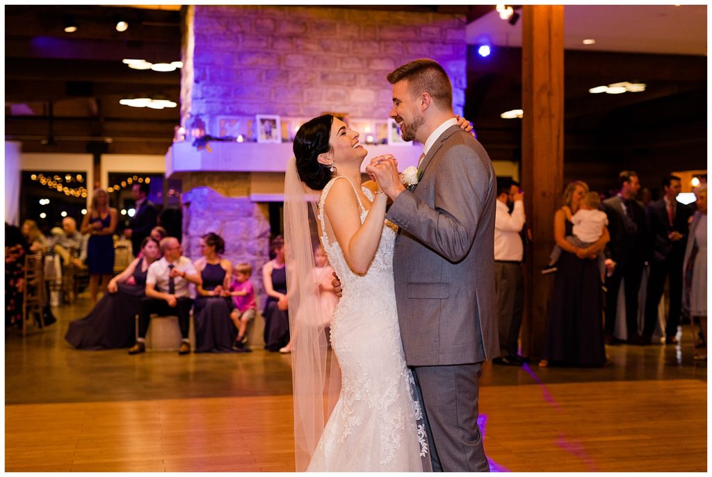 bride laughing during first dance at watersedge in hilliard