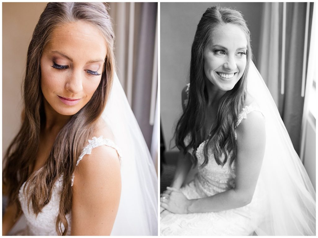 black and white image of bride sitting and smiling out window at renaissance hotel