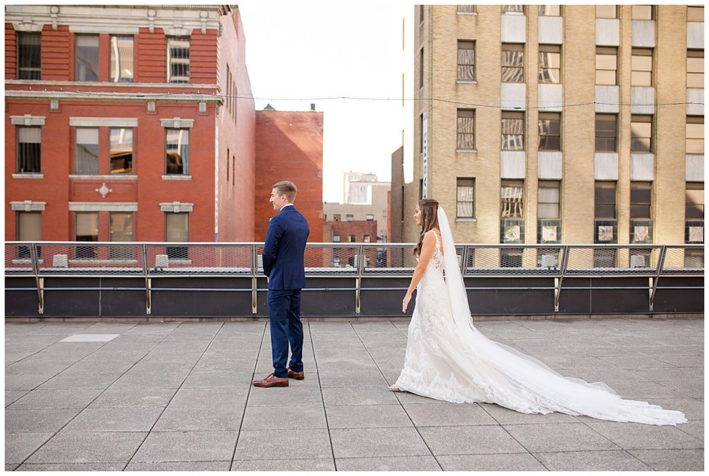 bride and groom about to see each other on rooftop at renaissance hotel