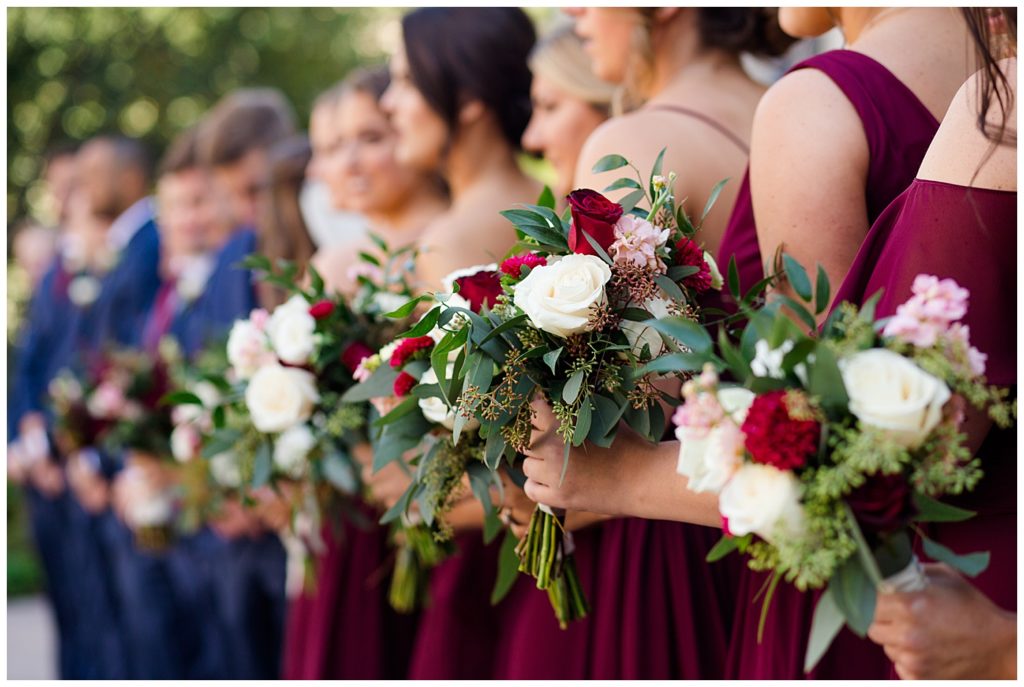 close up of bridesmaids holding bouquets