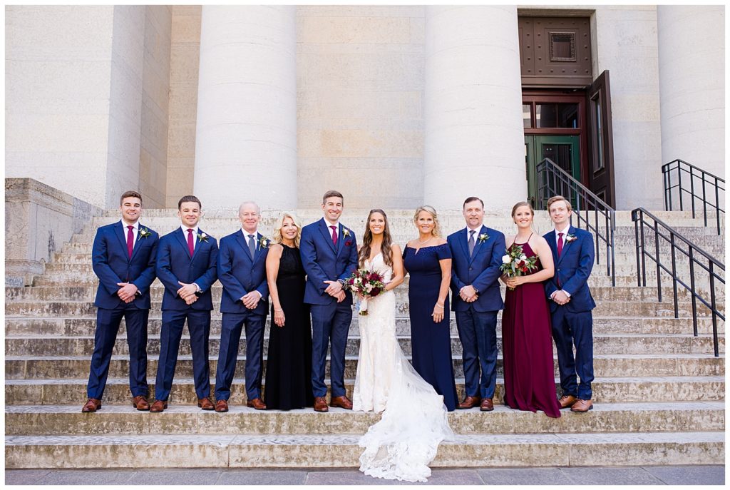 bride and groom and both families outside ohio statehouse