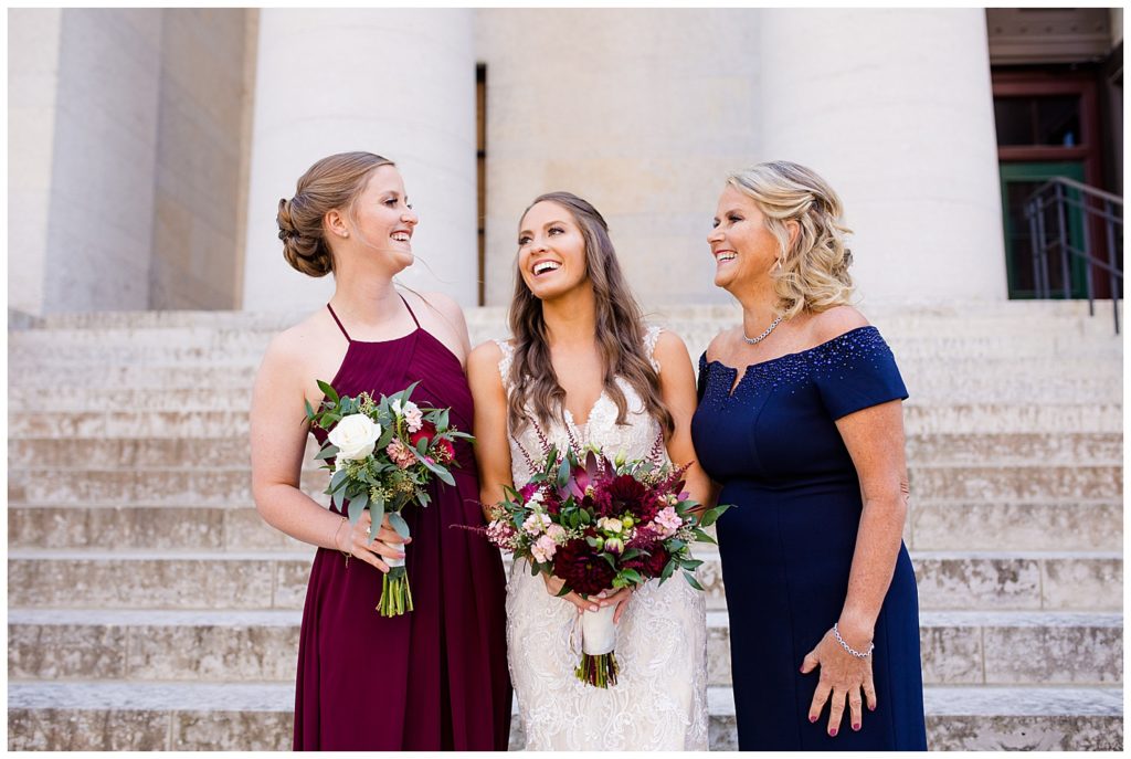 bride laughing with mom and sister outside ohio statehouse
