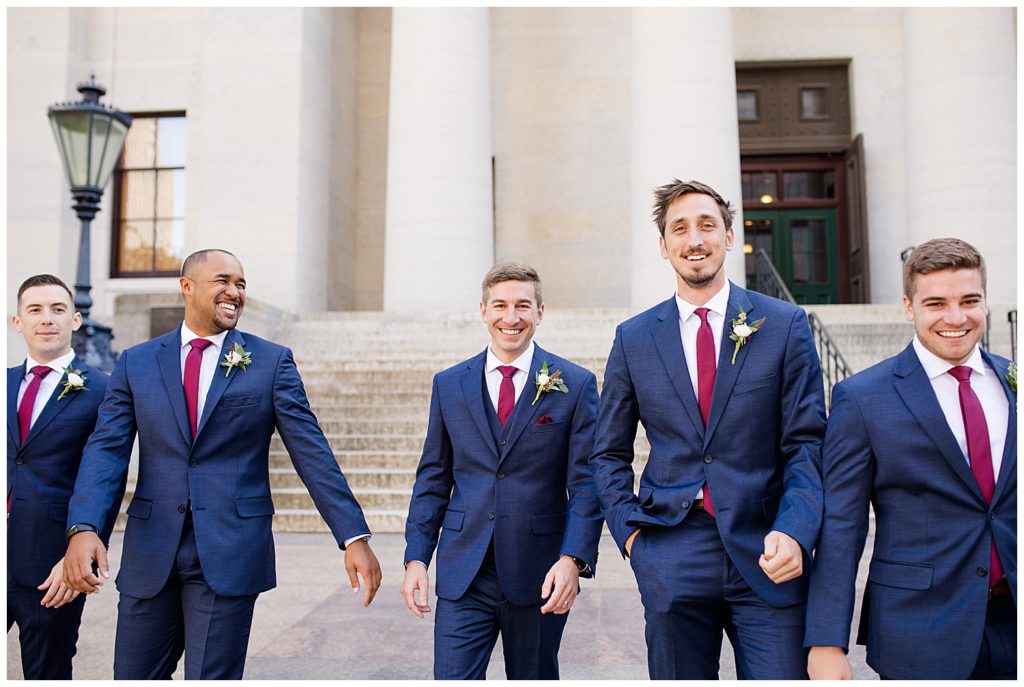 groom walking with groomsmen outside ohio statehouse
