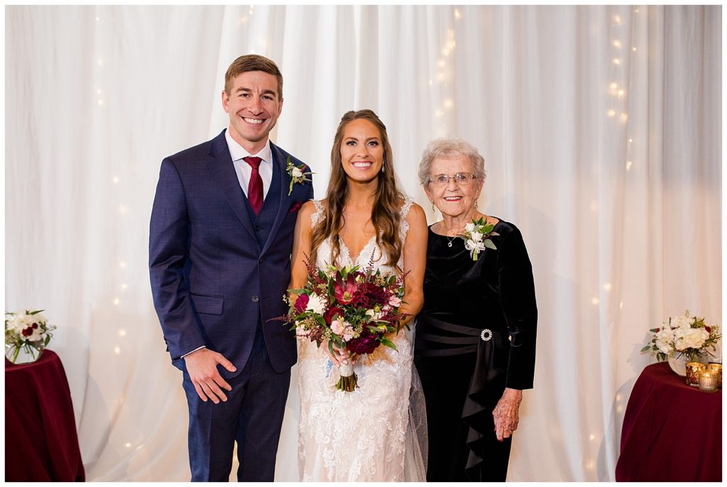bride and groom with bride's grandmother at copius