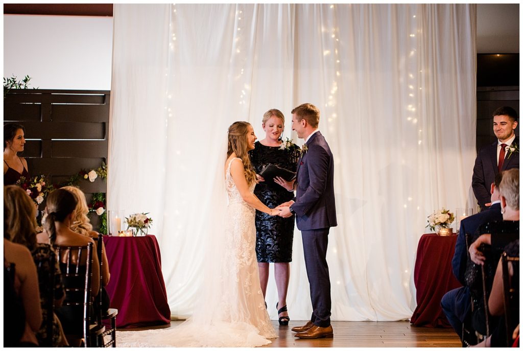 bride and groom laughing during ceremony at copius