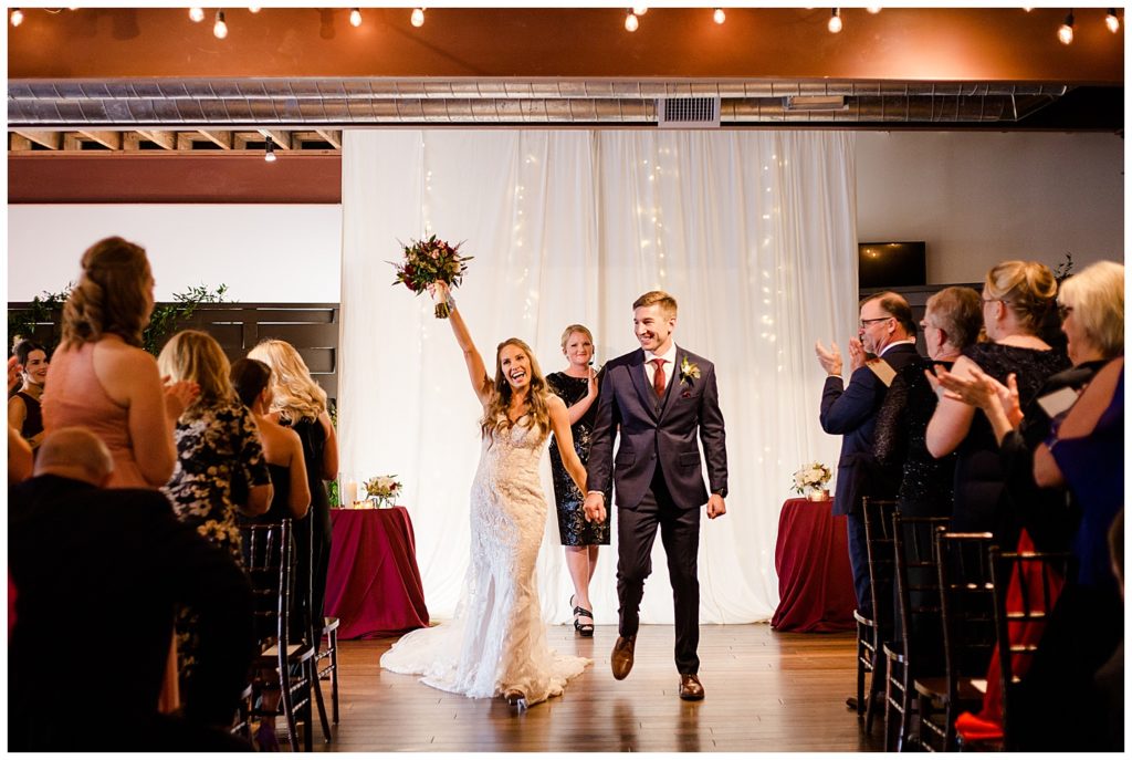 bride tossing bouquet in air after wedding ceremony at copius