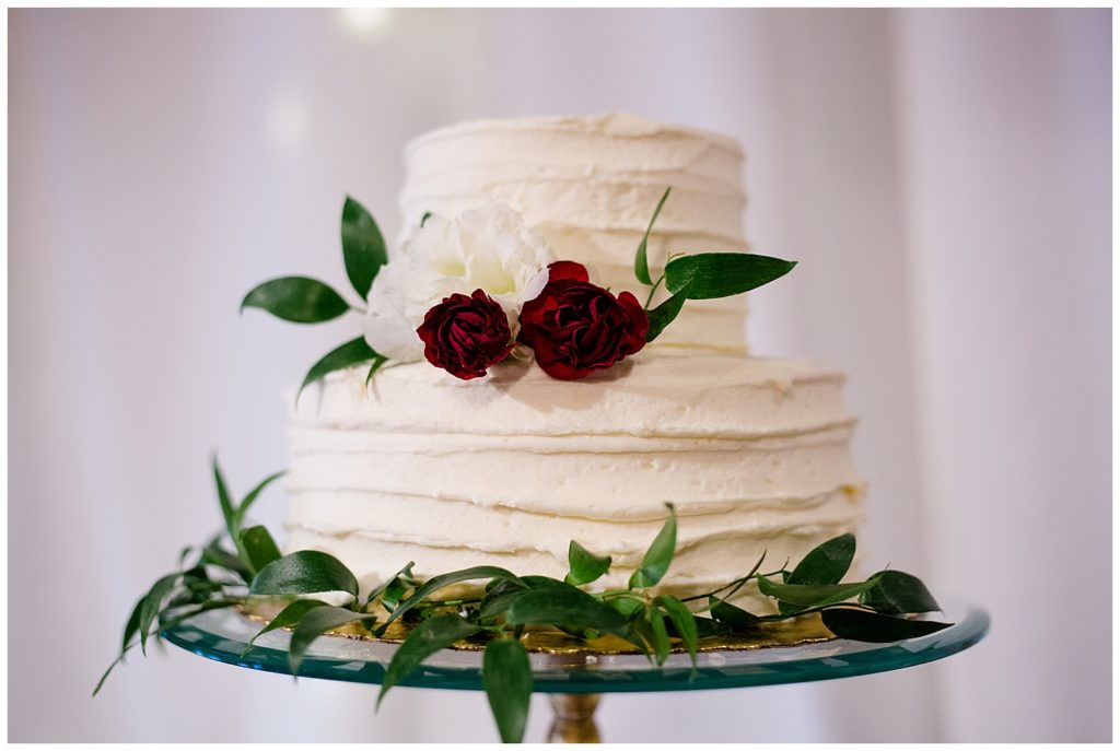 two tiered white wedding cake at copius