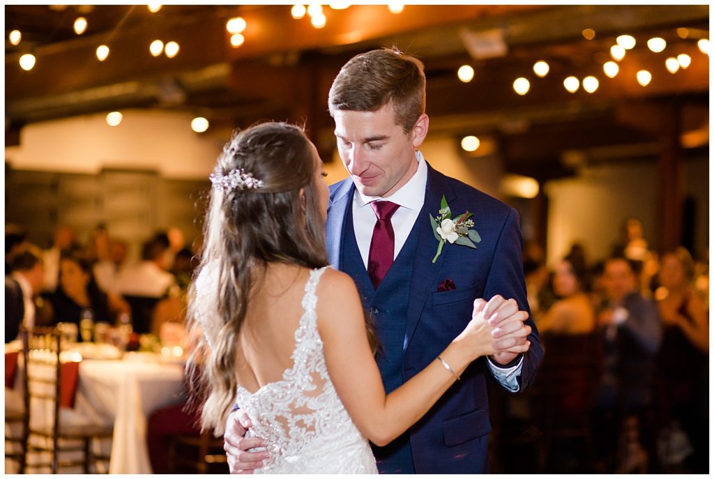 bride and groom share first dance at copius