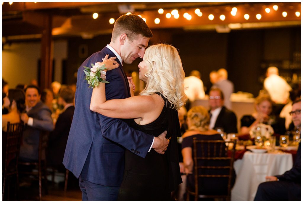 groom and mother dancing at copius
