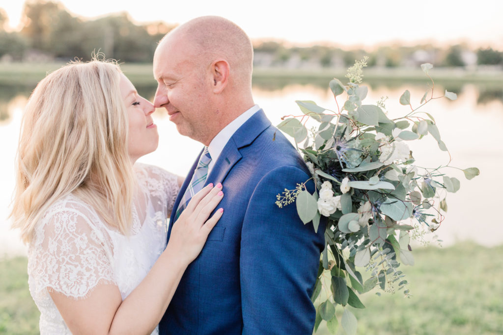 husband and wife nuzzling noses together
