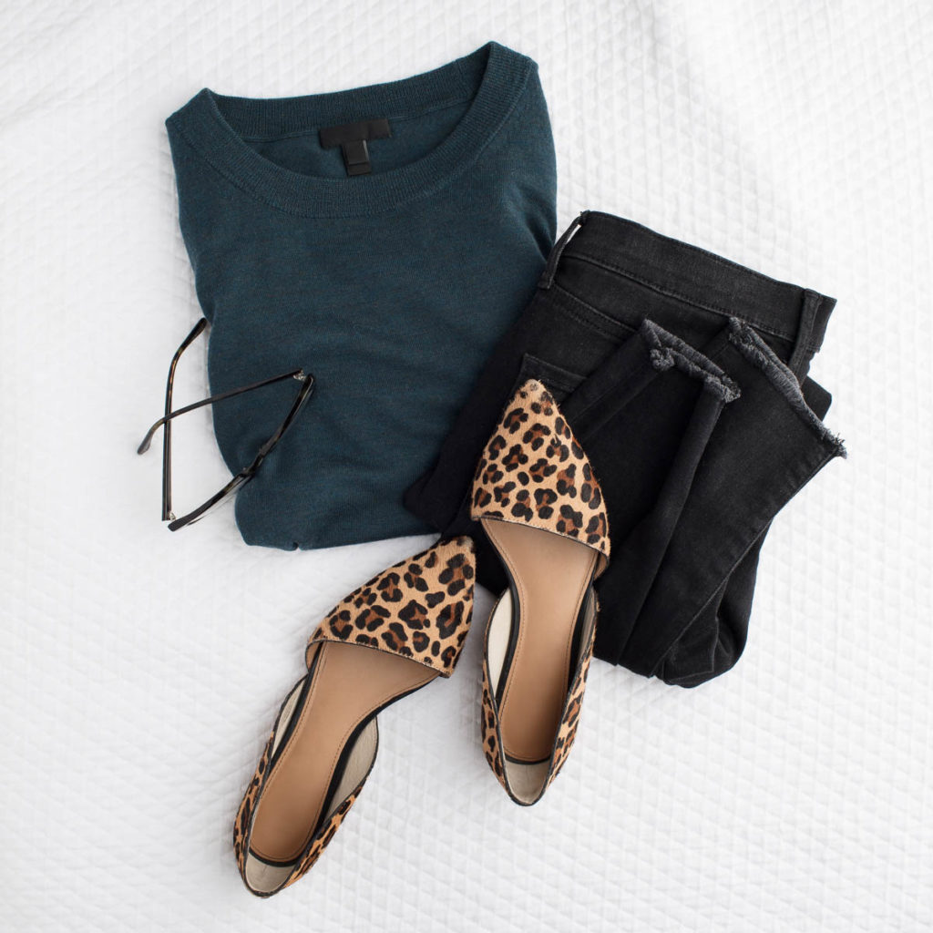 leopard shoes sitting with pants and shirt