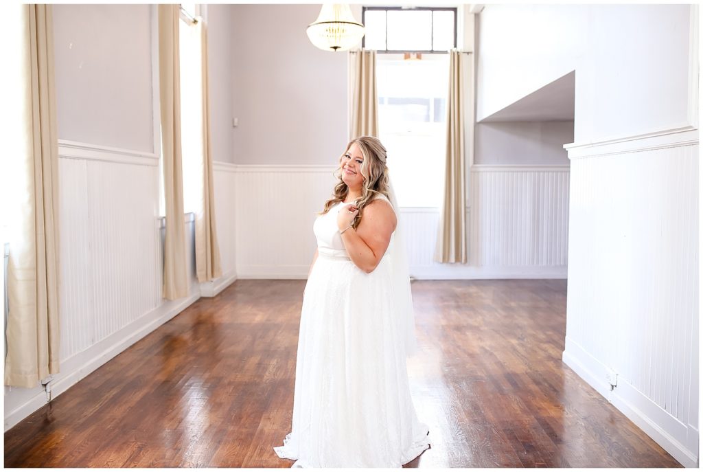 bride smiling at camera at the postmark
