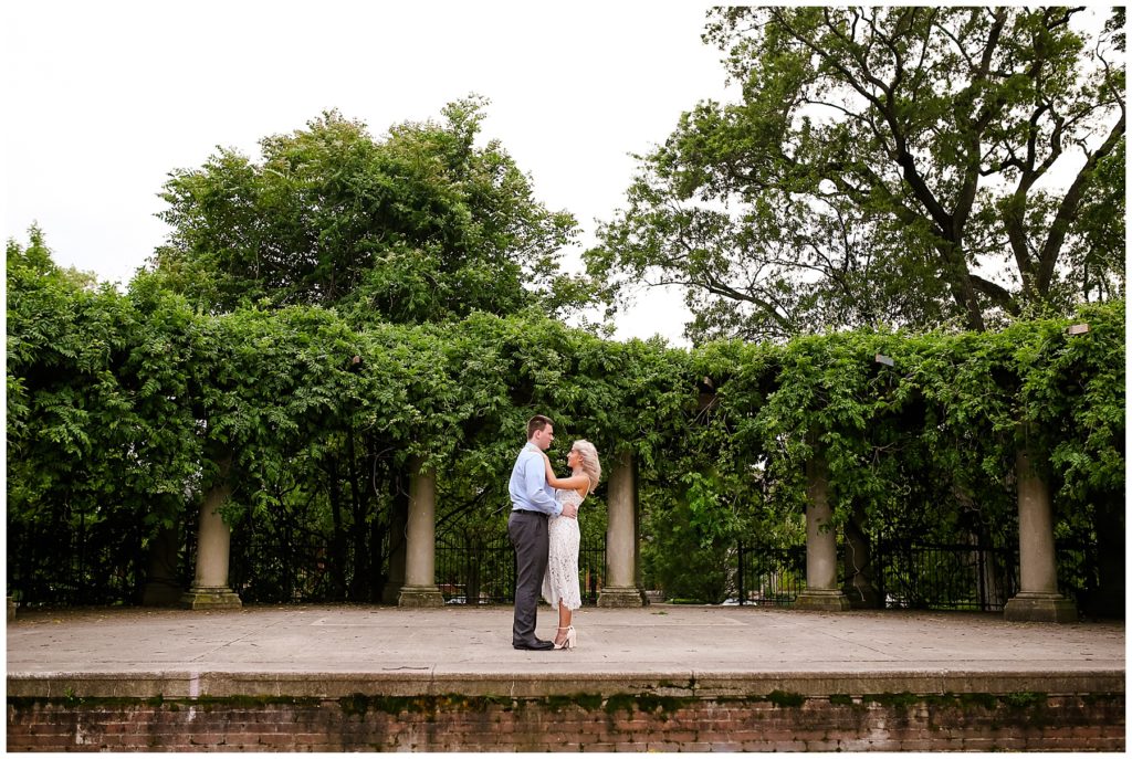 engaged couple standing on stage at schiller park