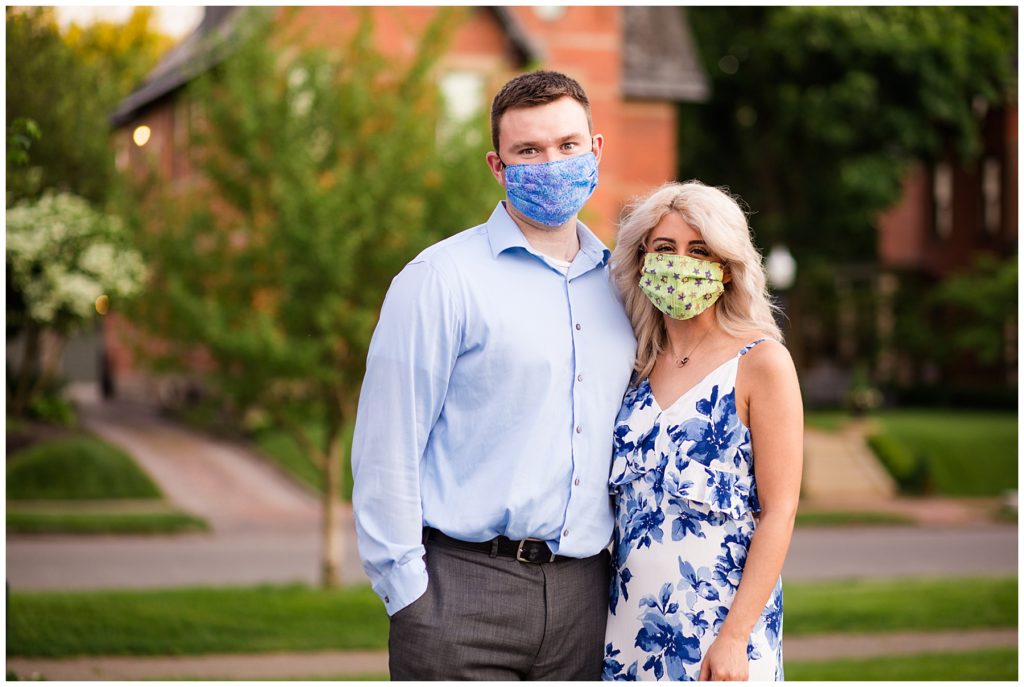 engaged couple wearing masks after photoshoot at schiller park